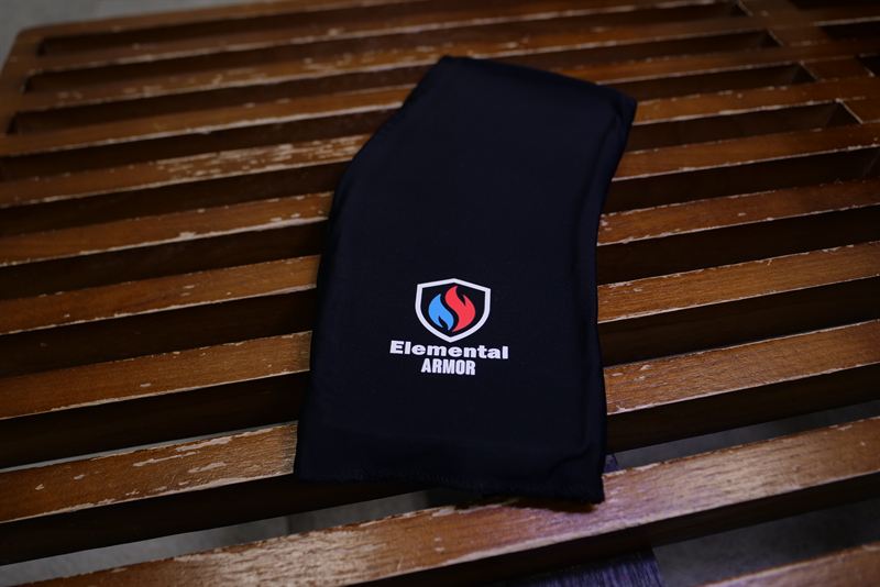 Elemental Armor Ankle Sleeve laid flat on a wooden bench