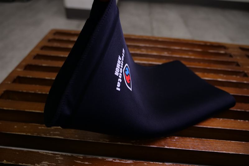Knee Sleeve standing upright on a wooden bench